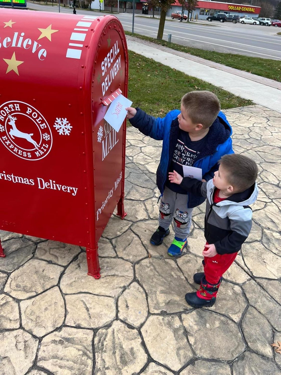 Mason and Jace Meixner send their letters to Santa in this special mailbox that was placed in the Harrison Town Square at the corner of Main and Second Streets